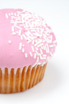 Extreme close up of muffin with icing sugar against a background