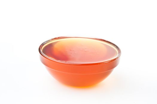 Honey bowl against a white background