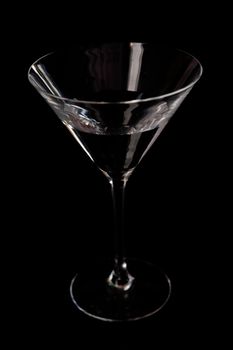 Cocktail glass against a black background