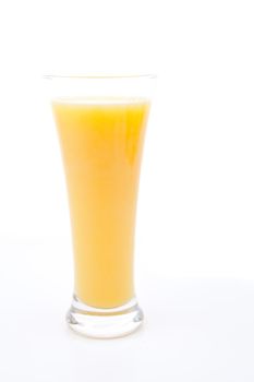 Glass full of orange juice against white background