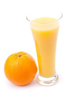 Glass full of orange juice placed near an orange against white background