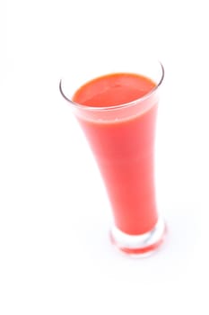 full glass of berries juice against white background