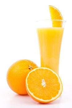 One orange and a half next to a glass of orange juice against white background