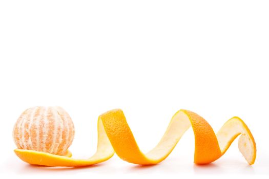 Orange posed on a orange peel against white background