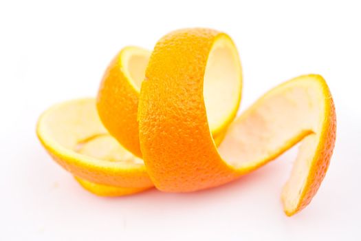 Orange peel against white background