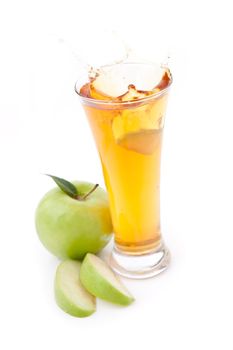 Apple juice and ice against a white background