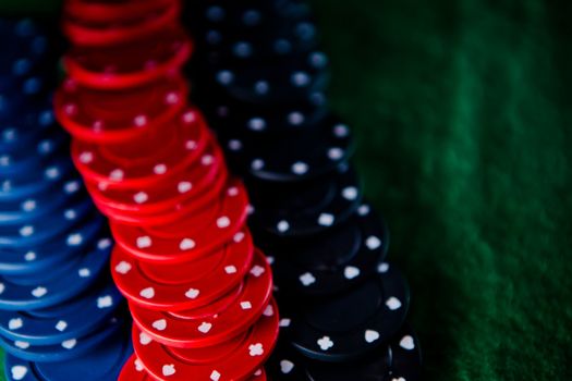 Heap of poker chips on the green mat