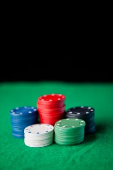 Gambling chips  against a black background