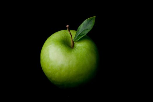 Apple fruit against a black background