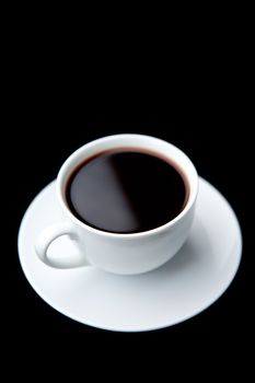 Cup of coffee against a black background