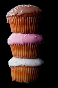 Tower of cupcake against a black background