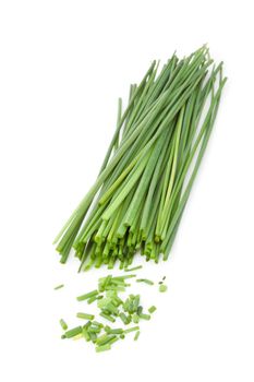 Freshly cut stands of chive against a white background