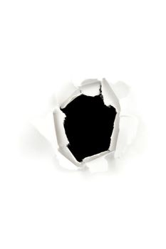 Circle hole in white paper against a white background