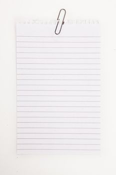 Blank page with grey paperclip against a white background