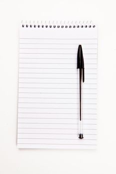 Notepad  with black pen sheet  against a white background