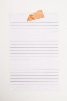 Paper blank with adhesive tape against a white background