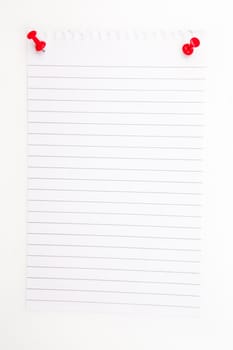 Blank paper with red pushpin against a white background