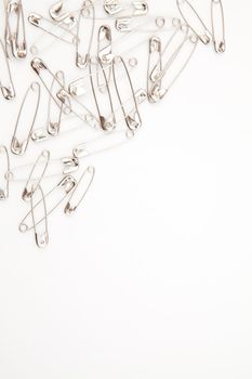 Grey paperclips against a  white background