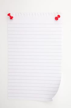 Blank paper with red pushpin against a white background