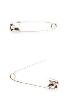 Two safety pin one opening an the other closing against a white background