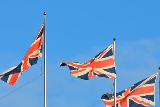 three union flags flying