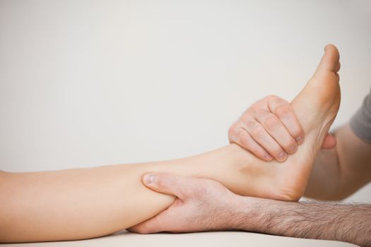 Muscle of a foot being massaged in a room