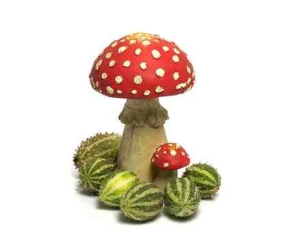 red white mushroom with green melons isolated on white