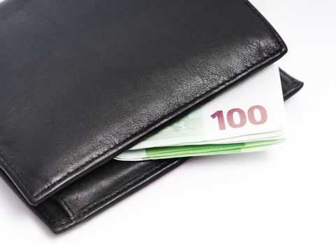 Leather wallet with some euros on a white background