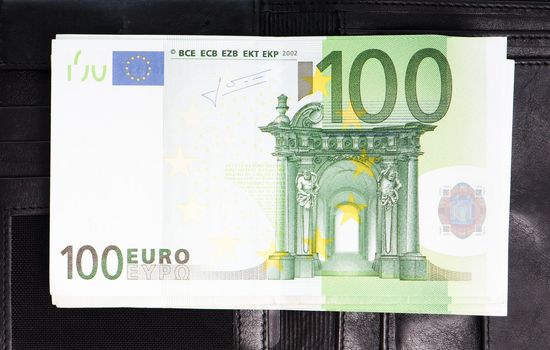 Euro banknotes on the black purse