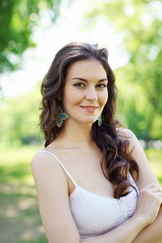 Beautiful young woman in the park. Outdoor portrait