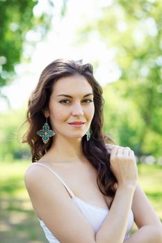 Beautiful young woman in the park. Outdoor portrait