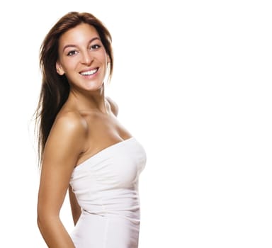 happy brunette woman turning around on white background