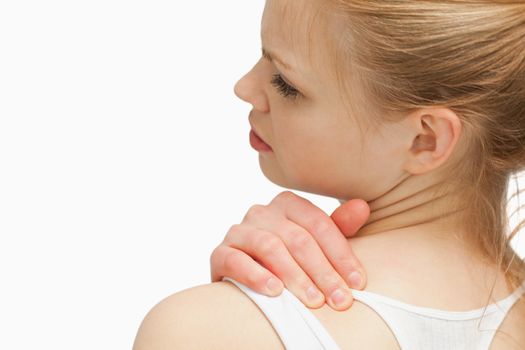 Close up of a woman massaging her nap against white background