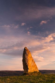 Menhir on the hill at sunset in Morinka in Czech Republic
