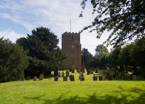 Ancient cotswold stone church and cemetery graveyard in Cotswold village of Ilmington