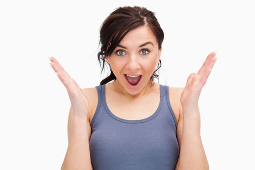 Happily surprised student against white background