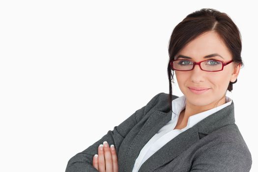 Businesswoman wearing red glasses against white background