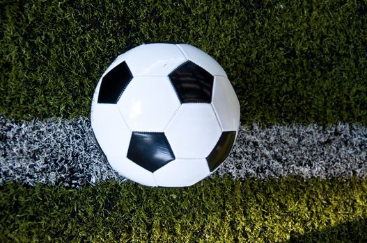 ball on white line of artificial grass  indoor football field