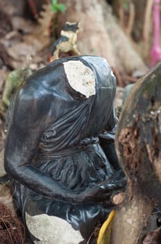 abandoned broken buddhism statue no head