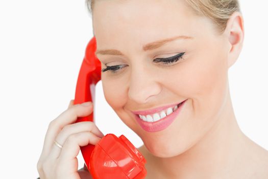 Face of woman calling against white background