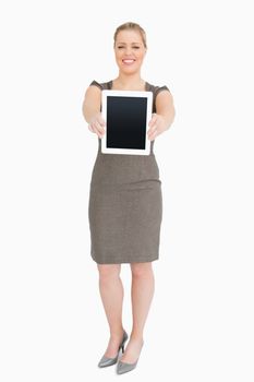 Woman standing showing an ebook screen against white background