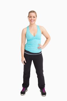 Woman with a hand on her hip against white background