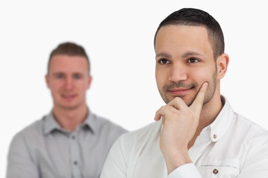 Two thoughtful men against a white background