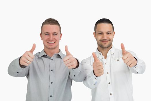 Men putting their thumbs up against a white background