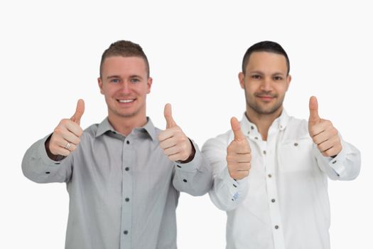 Two men putting their thumbs up against a white background