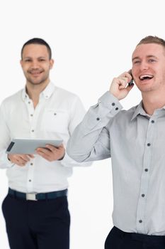 Laughing men with a phone and a tablet computer against a white background