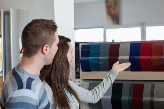 Customers watching different colours in a store