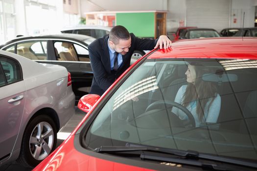 Woman trying a new car in a dealership