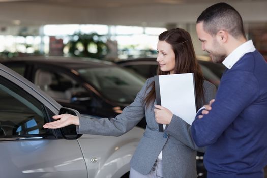 Man looking at a car in a dealership