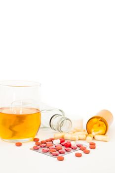 Suicide attempt with a mixture of alcohol and medications against white background